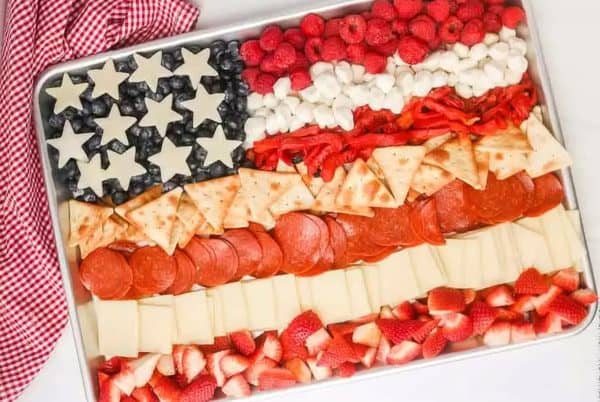  4th of july charcuterie board ideas in the shape of flags is fun. With meat, cheese, peppers, and more from eating on a dime. 