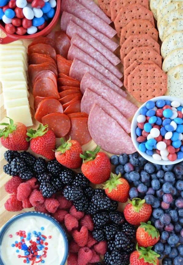 if you're looking for simple 4th of july charcuterie board ideas then kitchen concoctions has one that includes meat, cheese, and sweet candies. 