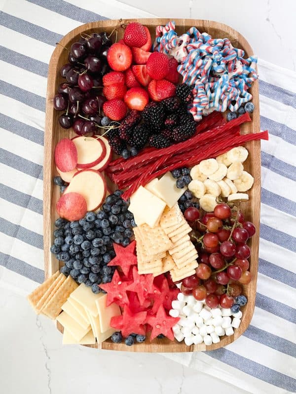 A simple board fromLovely lucky life with fruits, candies, crackers, and cheese. 