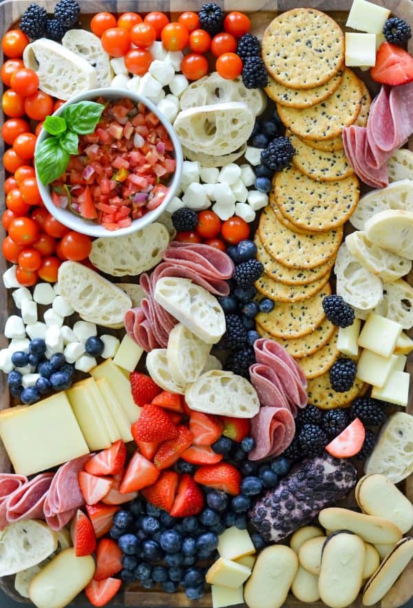 bruschetta, crackers, meat, and even tomatoes with fruit, and cookies make this board from mozlife tasty.
