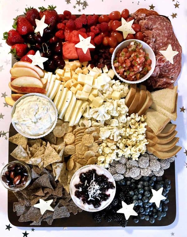 a traditional charcuterie board from regain your sparkle with fruit, meat, cheese, and more. 