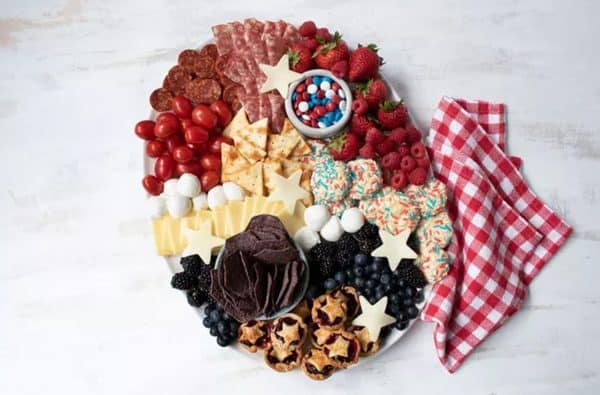 Homemade pies, cookies, and other elements like meats, cheese, and fruit complete this board from southern living.