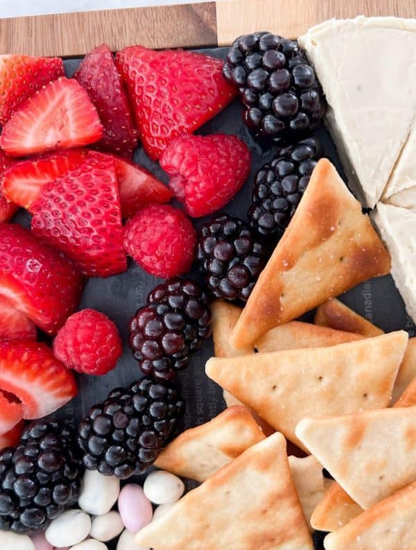 simple red, white, and blue board from the southernly magnolia with strawberries, brie, and blackberries. 