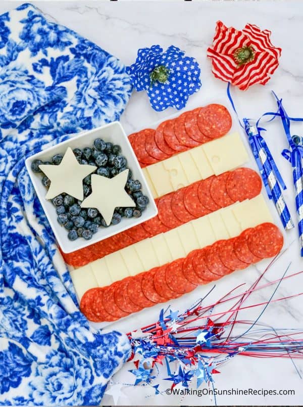 a simple flag design board with meat, cheese, and blueberries from walking on sunshine.