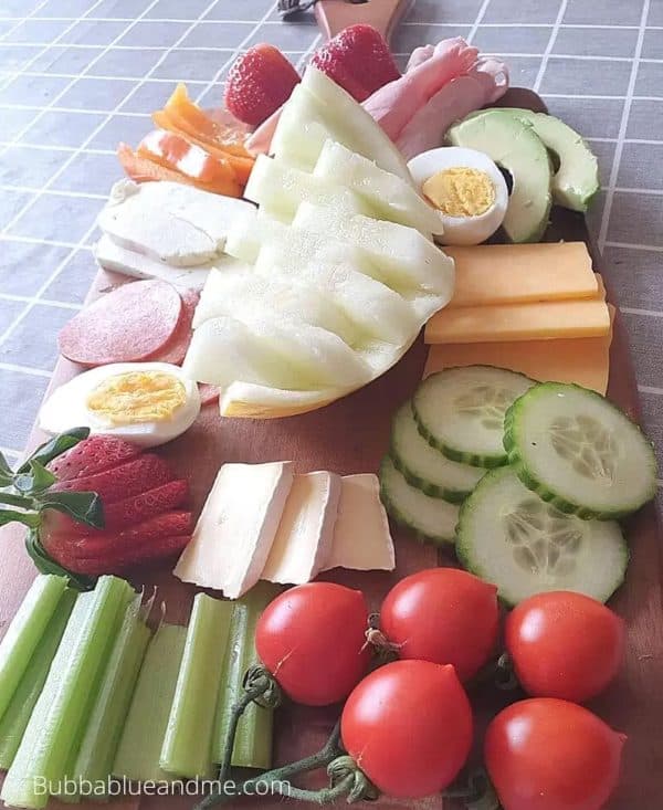 keto charcuterie board ideas from bubbablue and me with veggies, cheese, and eggs.