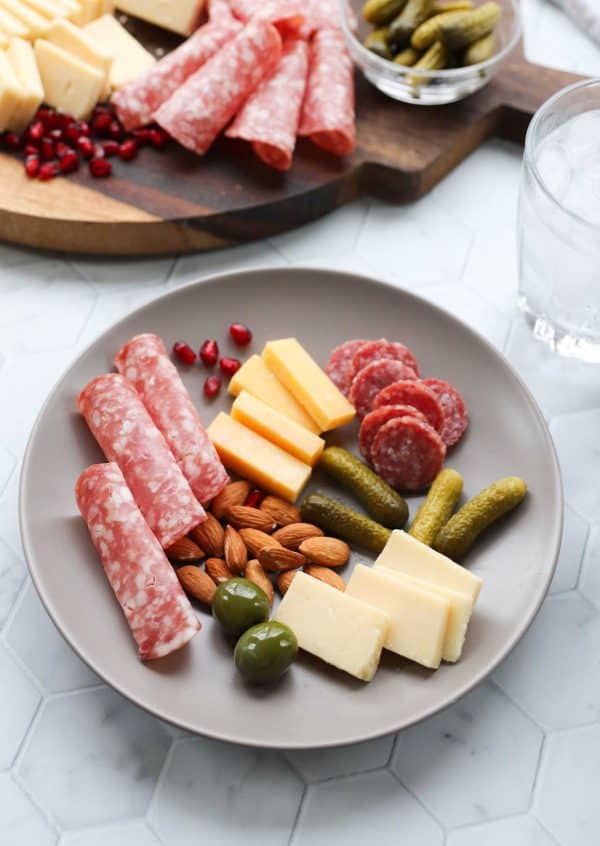 simple keto charcuterie board idea with meat, cheese, and pickles from cook at home mom
