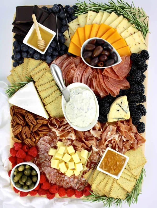 keto cooking christain charcuterie board with cheese, jam, crackers, and more