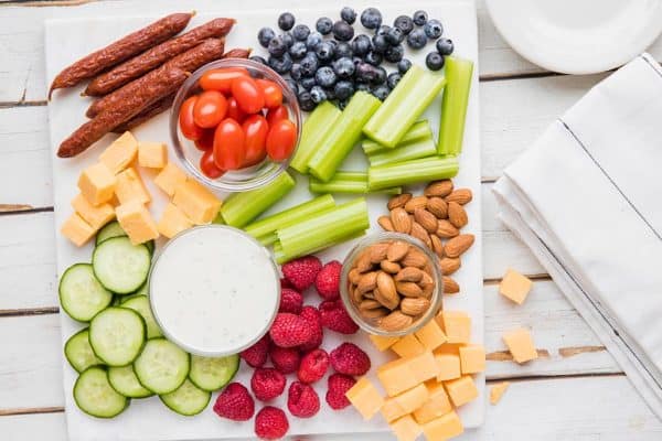 a simple board from ketofocus with veggies, fruit, and cheese chips