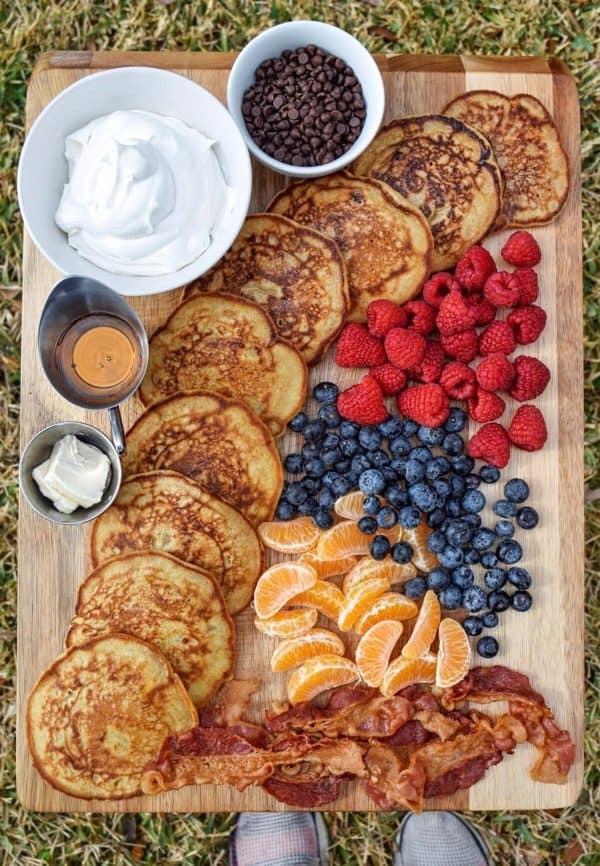 oatmeal banana pancakes, with whipped cream, raspberries, and blueberries from Fit foodiele. 