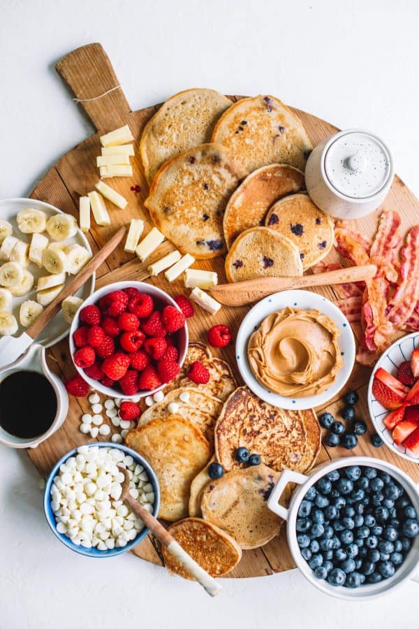 The college housewife includes blueberry pancakes, bowls of fruit, plates of bananas, and even some bacon! 