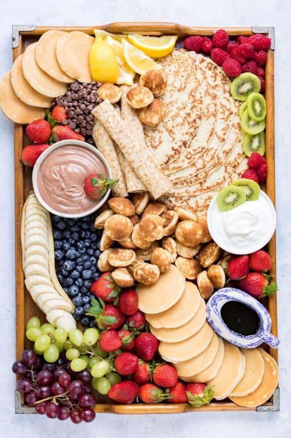 Crepes, pancakes, mini pancakes, and more make this board from veggie desserts delicious. 