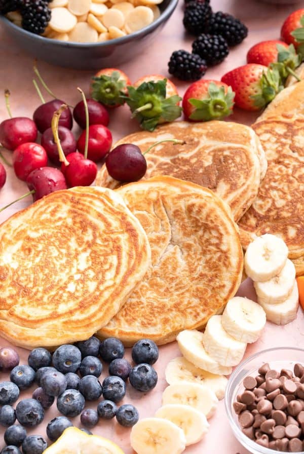 a pancake charcuterie board with blueberries, bananas, and more from wonky wonderful.