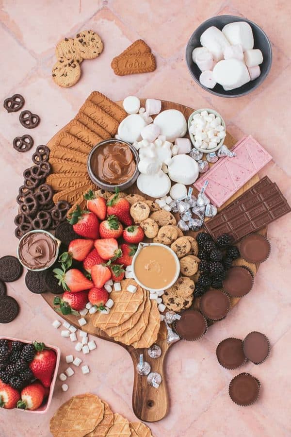 A beautiful s'mores board from a classic twist- cookies, candy, marshmallows and more.