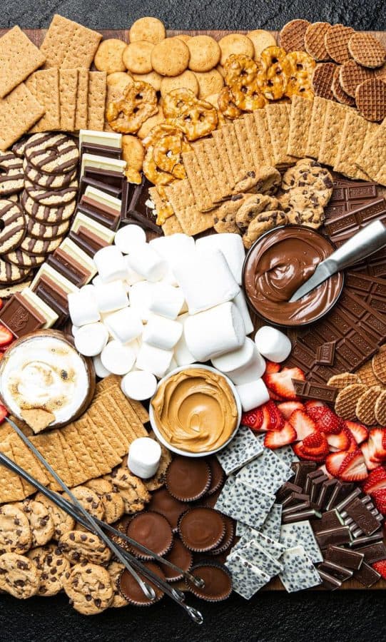 A giant board full of cookies, crackers, candies, and fruits from s'mores by Delish