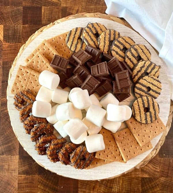 a simple board with cookies, chocolate, graham crackers, and marshmallows from momma lew.