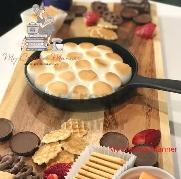a roasted s'mores dip in the middle, and some delish dipping options on the outside from My Creative Manner.
