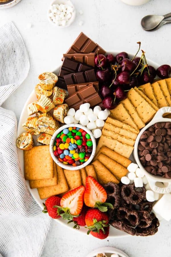 crackers, cookies, chocolate chips, mini marshmallows and other treats are great for a s'more. This board is from Nutmeg Nanny.
