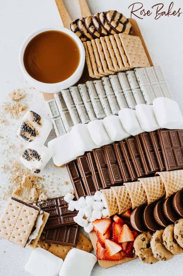 rose bakes- an organized s'mores charcuterie board with marshmallows, ice cream cones, chocolate 