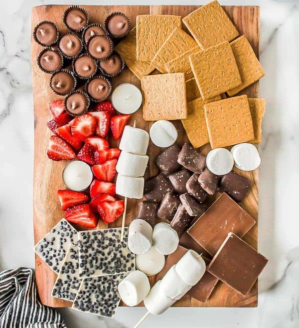 a simple s'mores charcuterie board recipe with different chocolate options from Scattered Thoughts