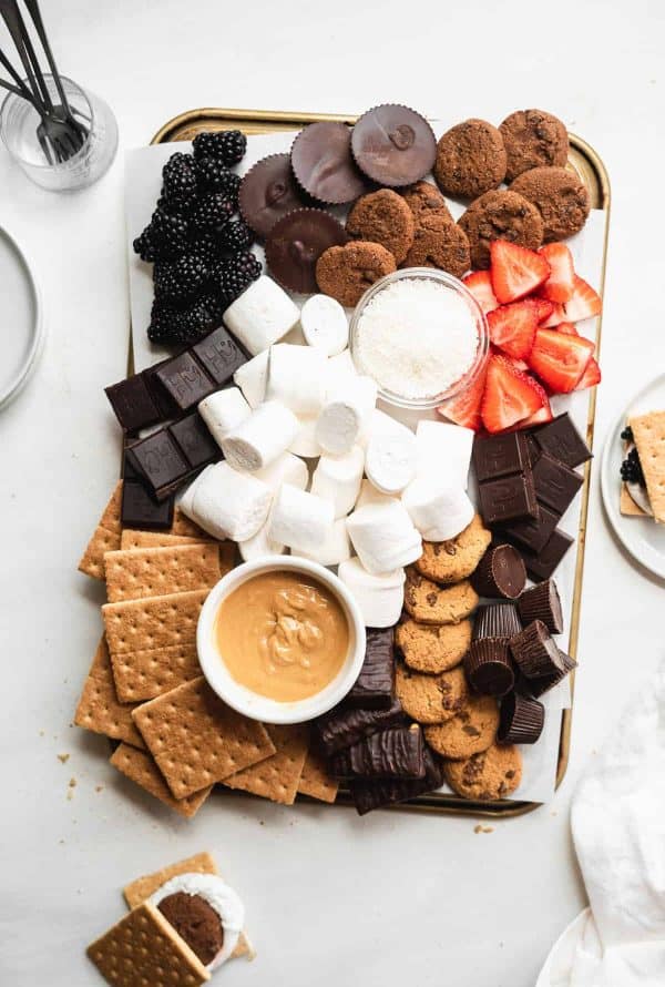 a cookie filled board with peanut butter, coconut,  graham crackers, and more from the Fit Peach