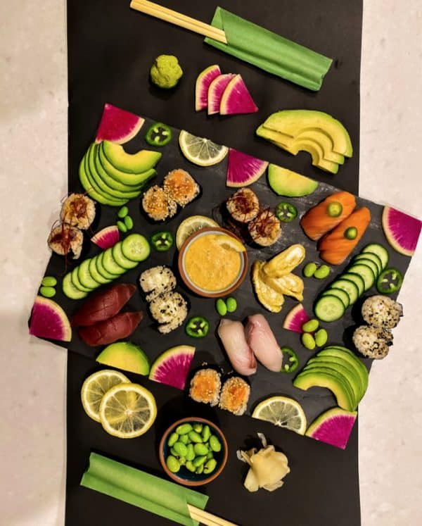 Herb your enthusuasm includes sushi, dip, avocado slices, and more. 