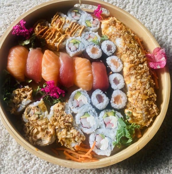 Just jennifer renee uses store bought sushi and sashimi to create a round sushi charcuterie board.