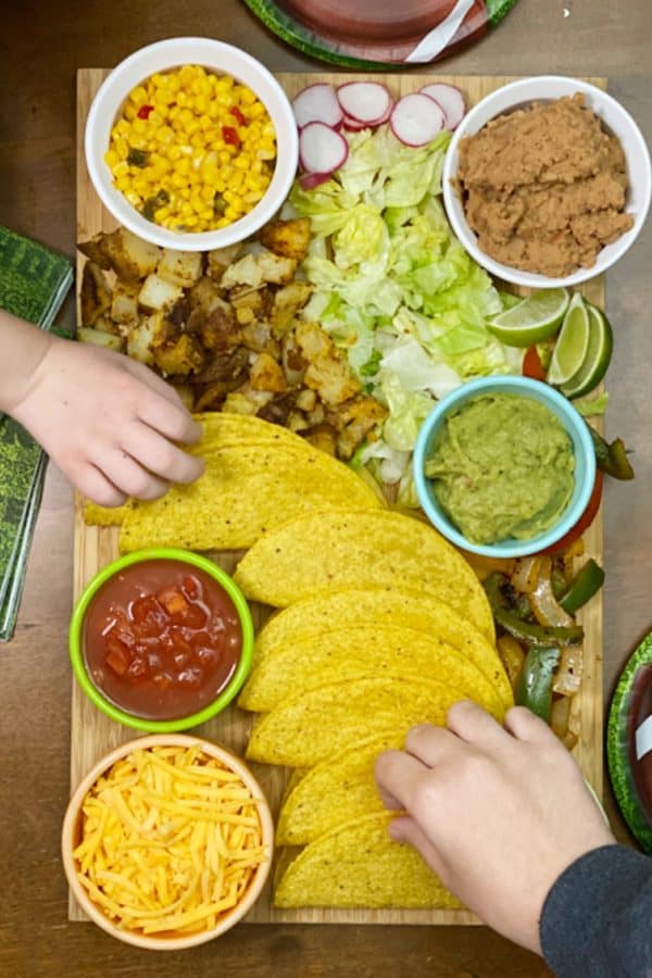 Hard shell tacos with potatoes, guacamole, beans, and more from Clementine county. 