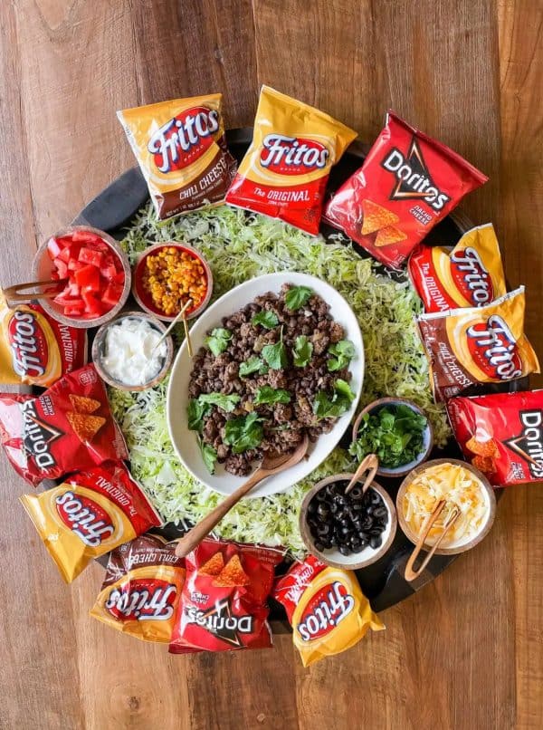 the walking taco board from The Recluctanrt entertainer. Backs of fritos, doritos, and all the taco stuffings in the middle. 