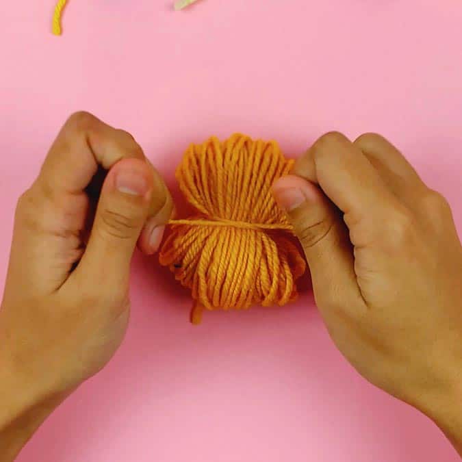 tie yarn around center of yarn