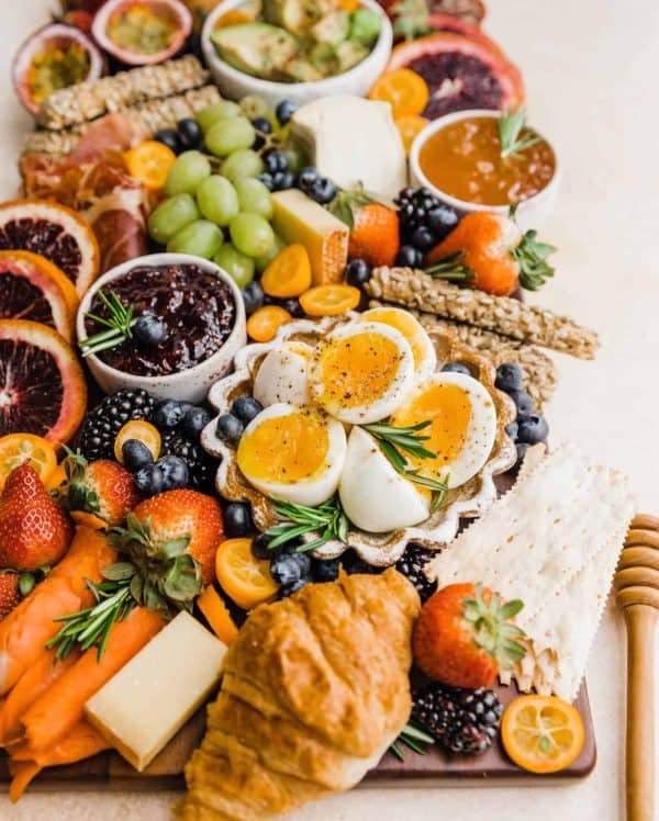 A brunch summer charcuterie board with eggs, cheese, and fruit from Britney breaks bread.