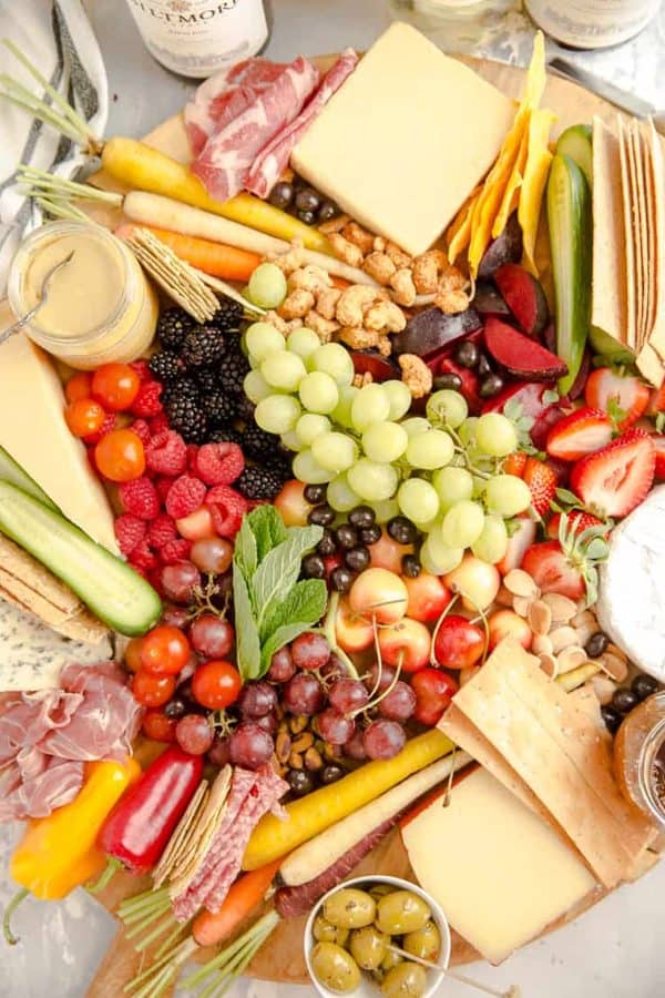 summer charcuterie board ideas from lemons for lulu. A traditional charcuterie board with fruits, cheese, veggies, and more.