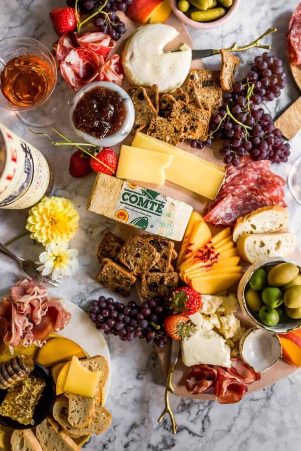 a summer charcuterie board with cheese, dips, and stone fruit like peaches from lenas kitchen
