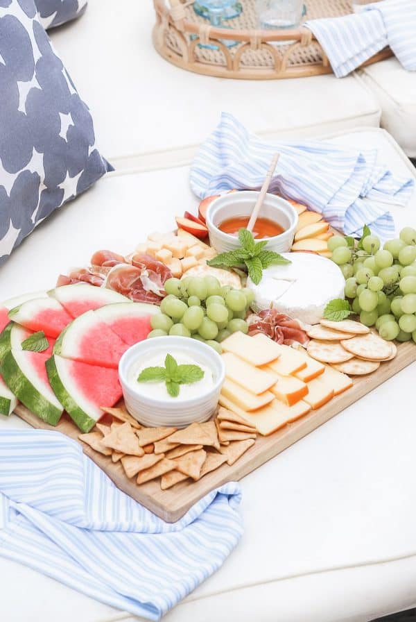 a simple board with watermelon, cheese, and crackers from the diary of a debutante