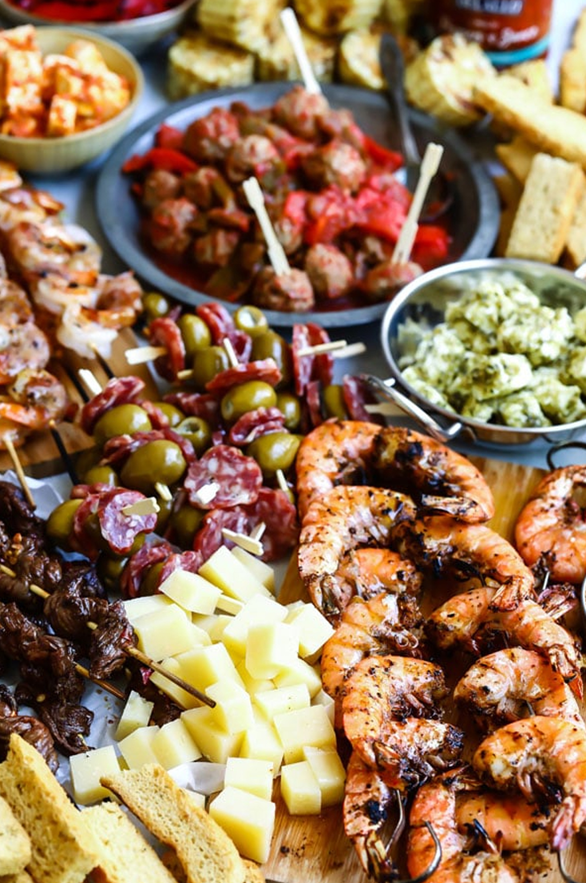 DeLallo's bbq charcuterie board idea with seafood, cheese, meat, and more.