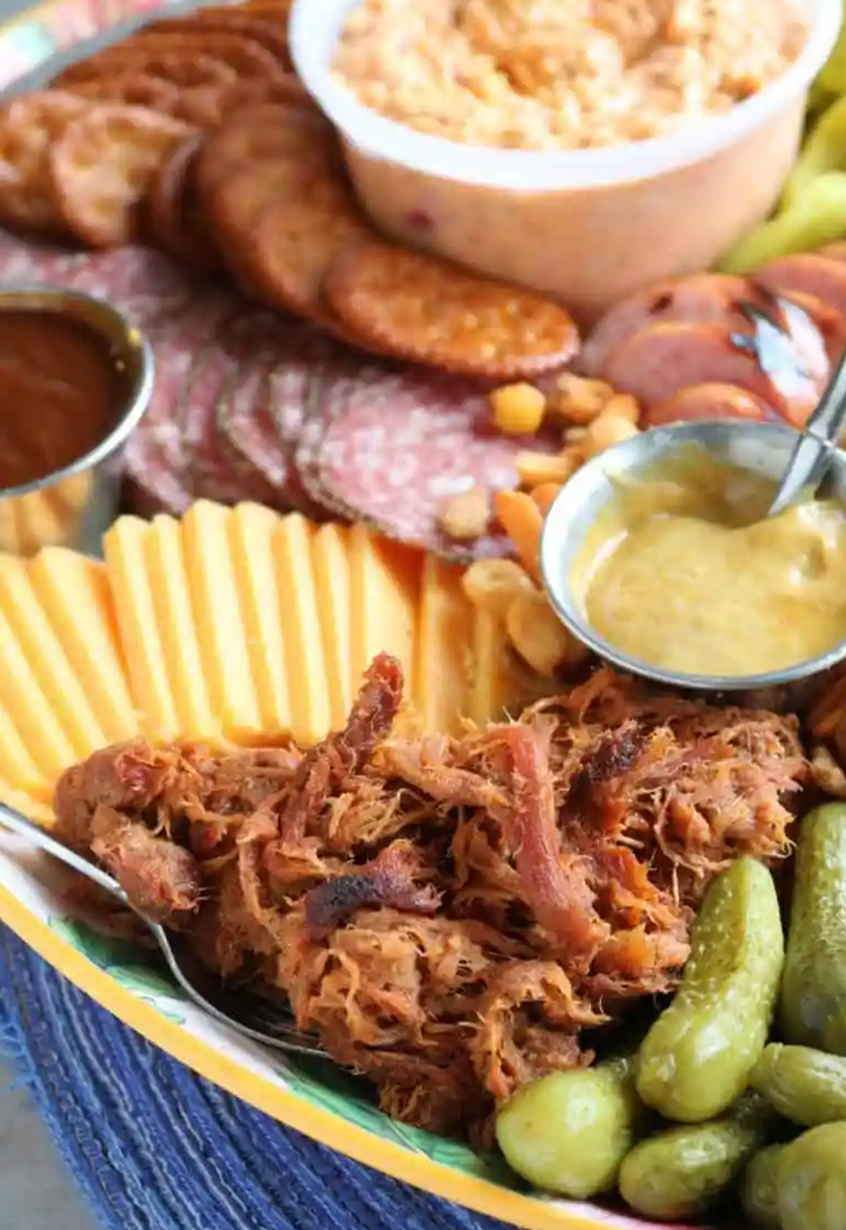 simple pulled pork and charcuterie meats make this board from the spiffy cookie easy.