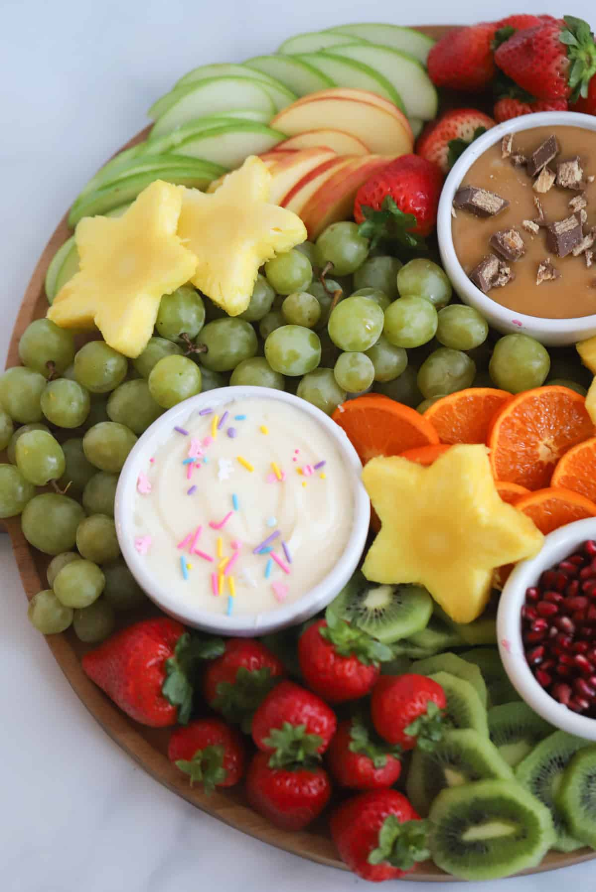 Fresh fruit is all you need with this board from The Carefree Kitchen. With multiple fruit dips, guests will love this baby shower charcuterie board idea.