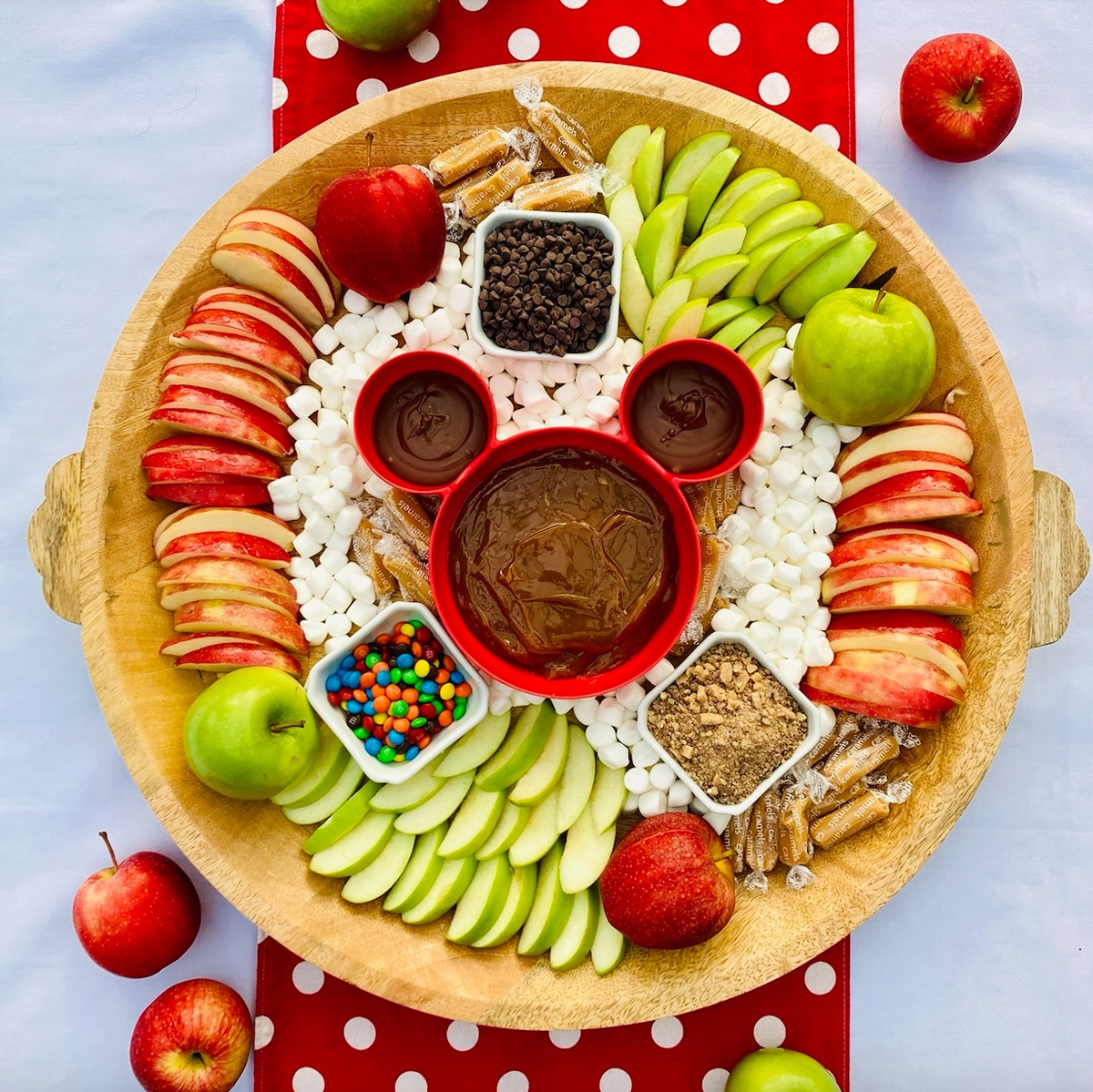 Pixie Dust and Posies' Board includes apple slices, caramel sauce, m&m's and chocolate chips.
