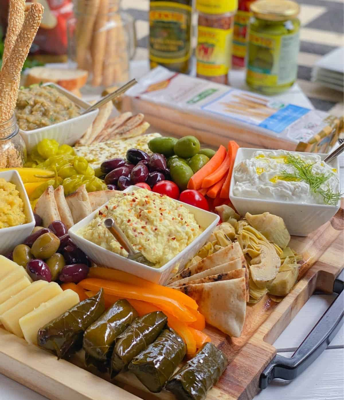 A board full of greek flavor with artichokes, peppers, veggies, breadsticks, and more from Aleka's get together.