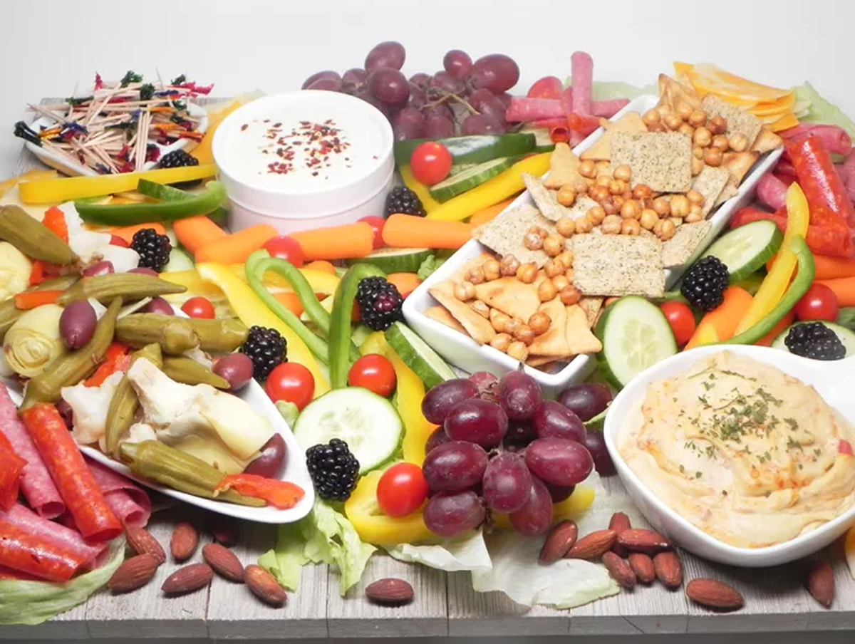 Allrecipes has a greek charcuterie board idea with many choices from hummus to chic peas and pita chips.