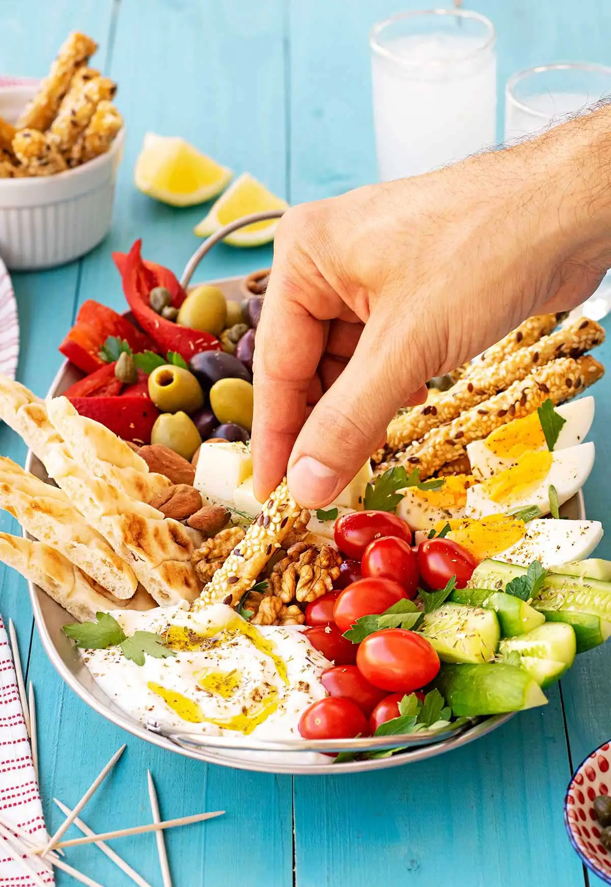 The hungry bites includes breadsticks, cucumbers, olives, and even hard boiled eggs on their small greek charcuterie board.