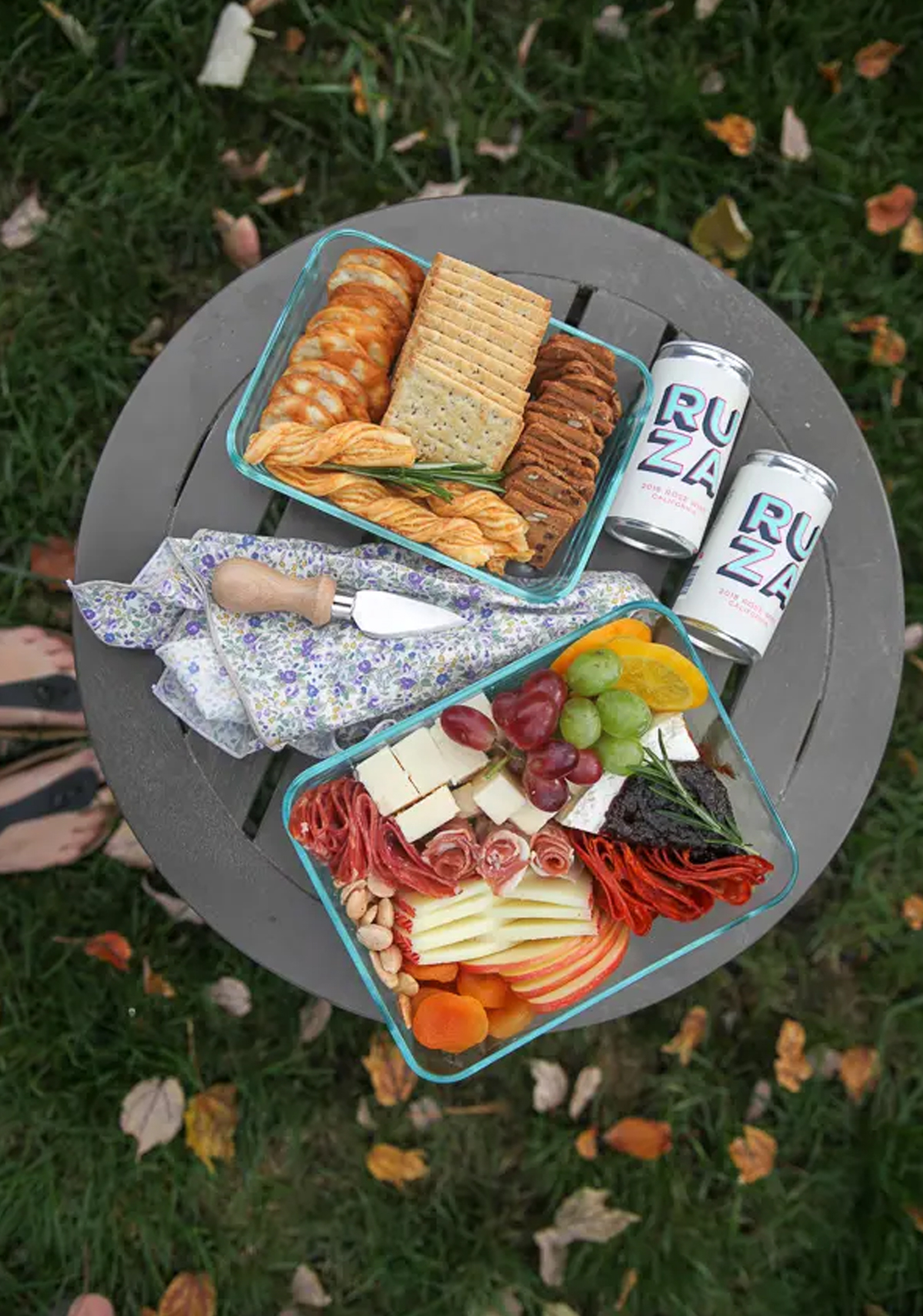 two glass containers of crackers, fruit, cheese, and meat from katheats.