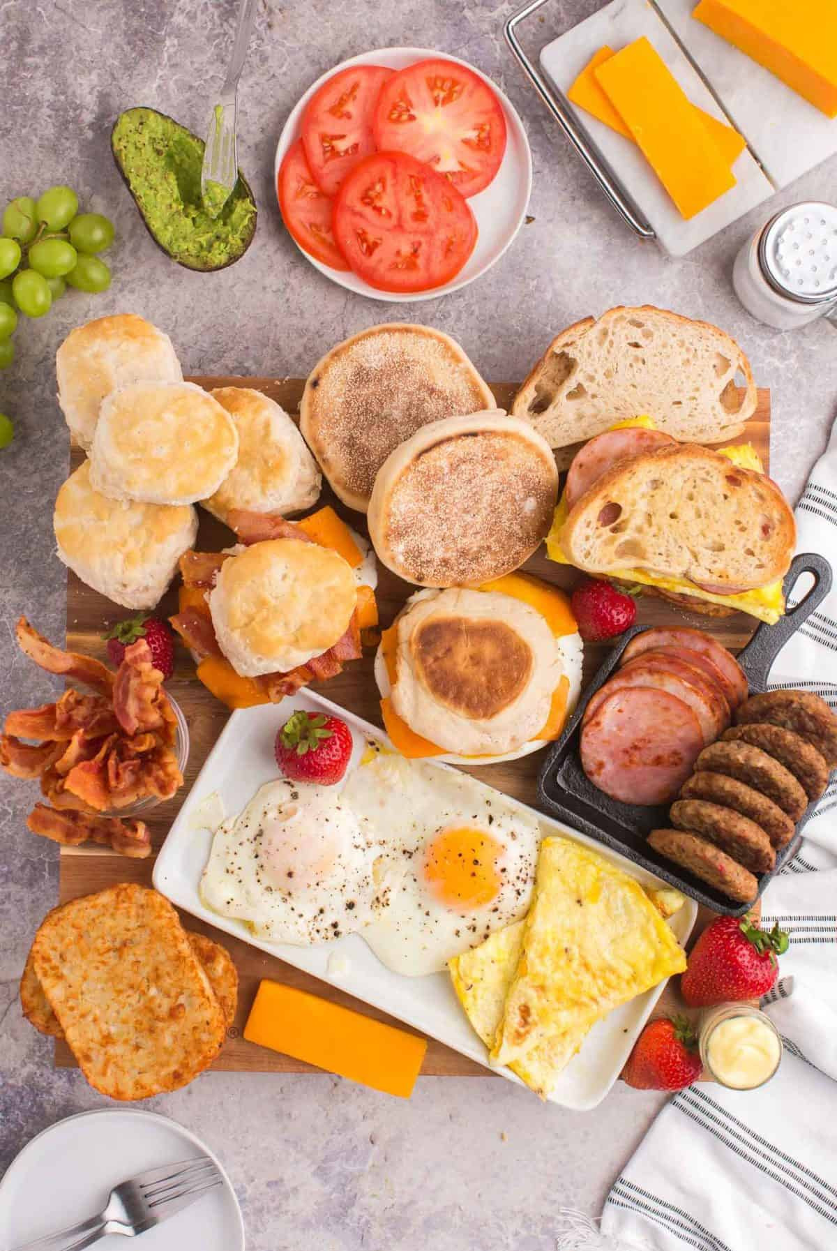 Pancake Recipes Egg Sandwich Board is full of avocado, English muffins, eggs, bacon, ham, and sausage.