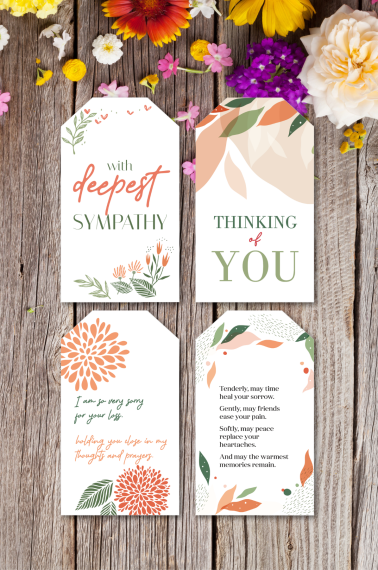 Image shows 4 printable sympathy message tags over a wooden background.