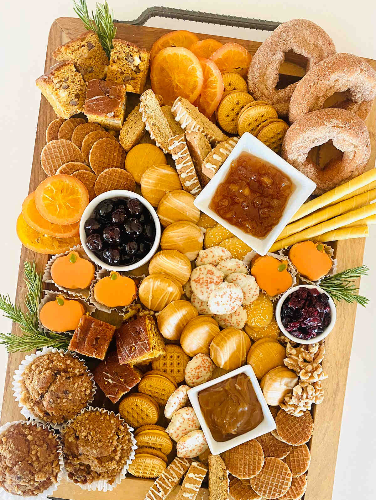 Aubrey's Kitchen's charcuterie board includes apple cider donuts, cookies, dried fruit, and pumpkin flavored treats.