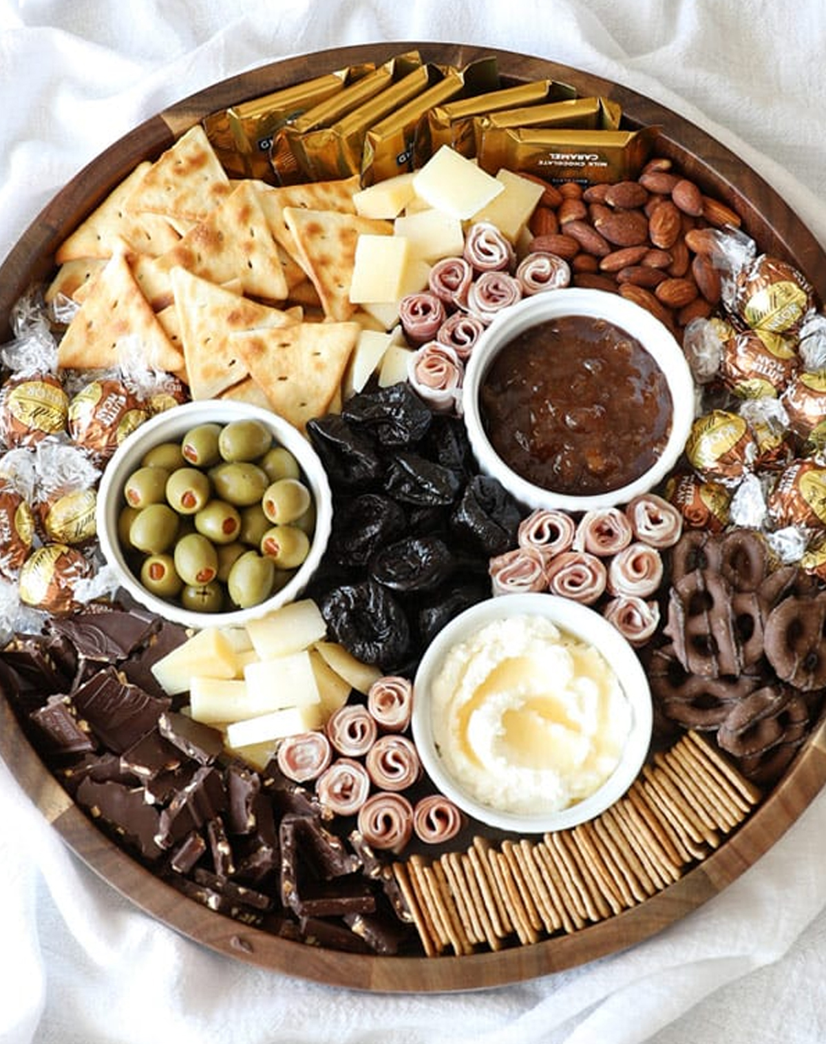 Bellyfull's fall board is full of chocolate, dip, crackers, meat, and cheese.