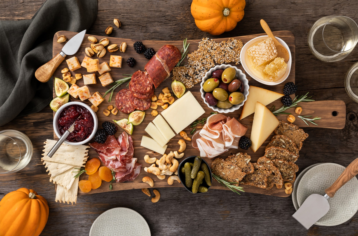 Bothwell Cheese's autumn charcuterie board shows nuts, cheese, meats, and olives.