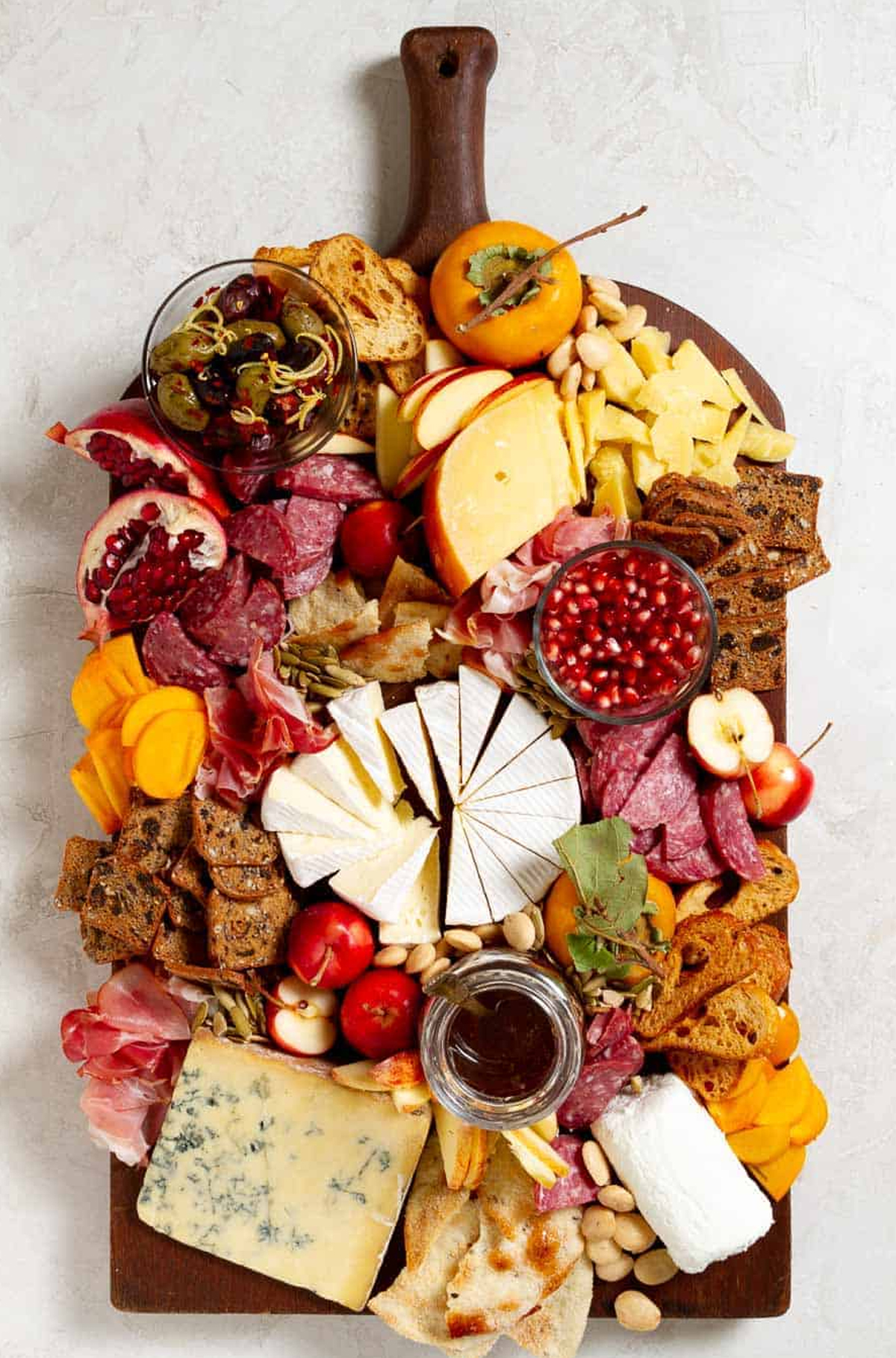 Cup of Zest's fall board displays meat, cheese, dried fruit, and crackers.