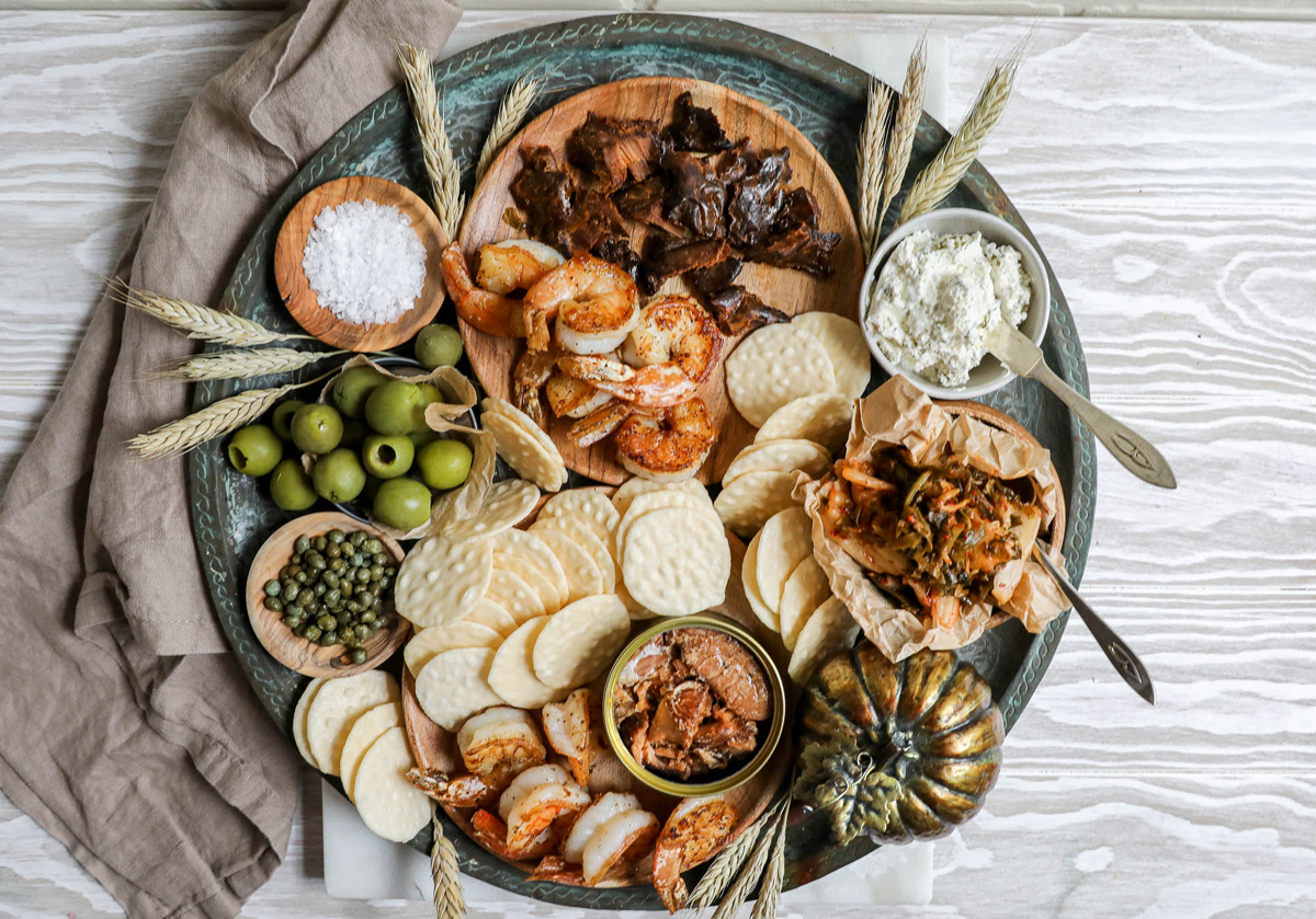 Grilled shrimp, capers, tuna jerky, crackers, and olives make up Jenny Shea Rawn's fall board.