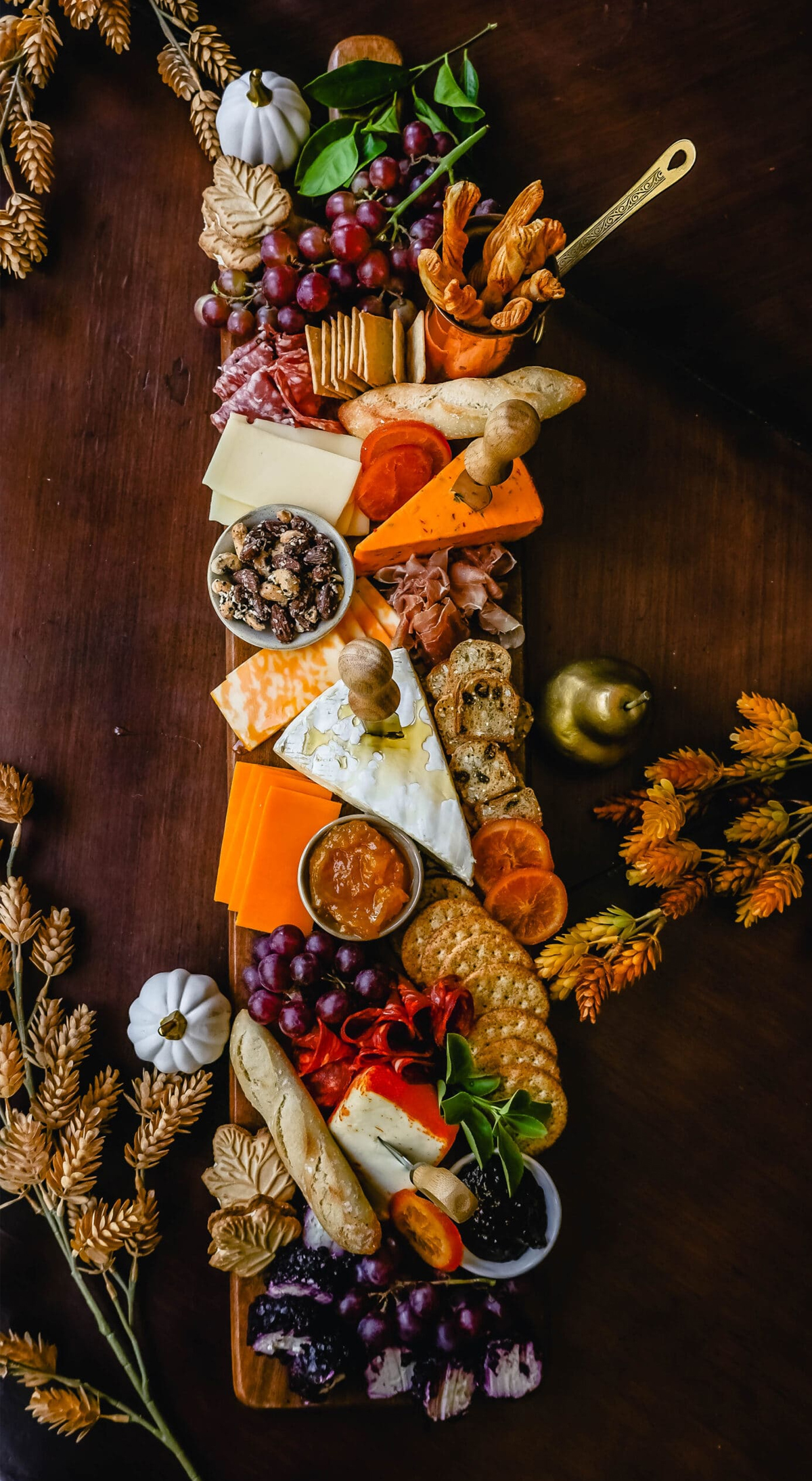 Modern Honey's fall board is full of crackers, meat, grapes, and cheese.