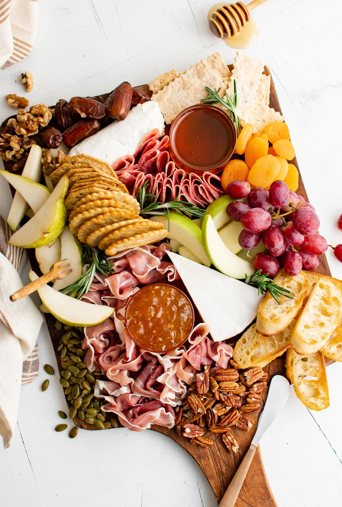 Grapes, crackers, nuts, meats, and fruit fill More Than Meat and Potatoes' fall board.